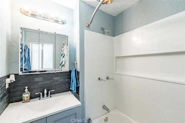 23120 Sycamore Ln, Crestline, CA 92325 - full bathroom featuring shower / bath combination, vanity, a textured wall, and backsplash