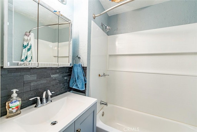 23120 Sycamore Ln, Crestline, CA 92325 - full bath with shower / washtub combination, vanity, backsplash, and a textured wall