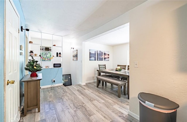 23120 Sycamore Ln, Crestline, CA 92325 - dining area featuring wood finished floors and baseboards