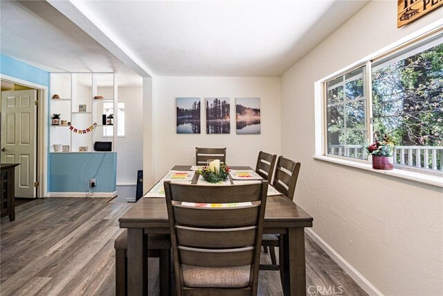 23120 Sycamore Ln, Crestline, CA 92325 - dining area with dark wood-type flooring and baseboards