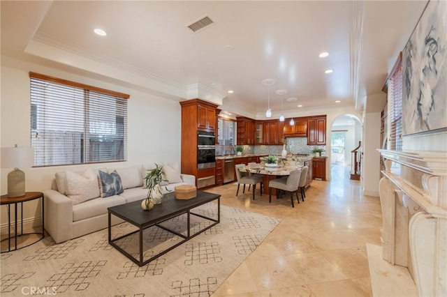 416 15th St, Huntington Beach, CA 92648 - living room featuring arched walkways, crown molding, recessed lighting, and light tile patterned floors