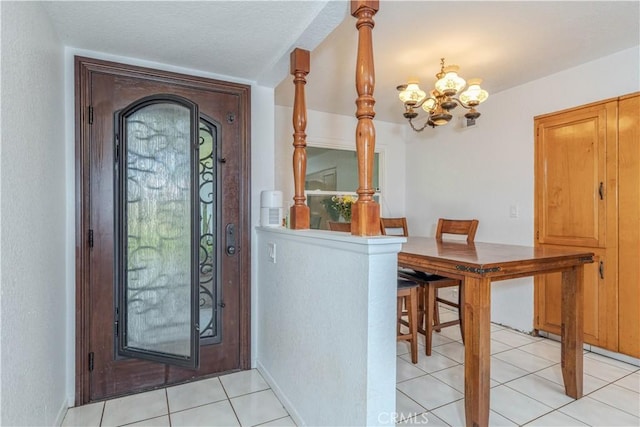 8922 Tracy Ave, Garden Grove, CA 92841 - entryway with a chandelier and light tile patterned flooring