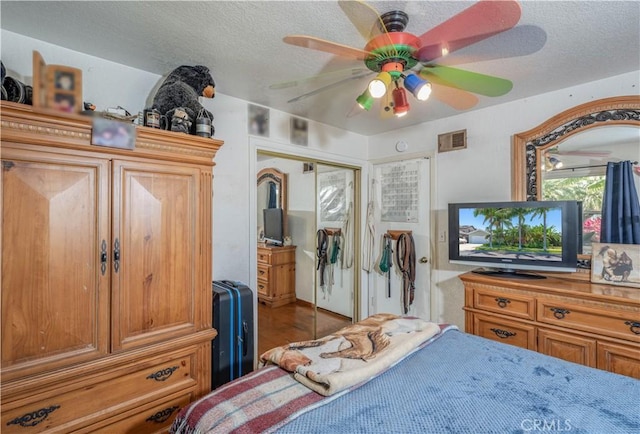 8922 Tracy Ave, Garden Grove, CA 92841 - bedroom with a closet, ceiling fan, a textured ceiling, and wood finished floors