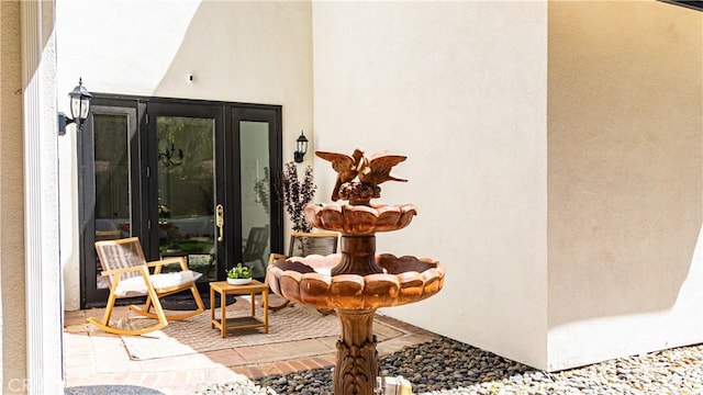 entrance to property with stucco siding