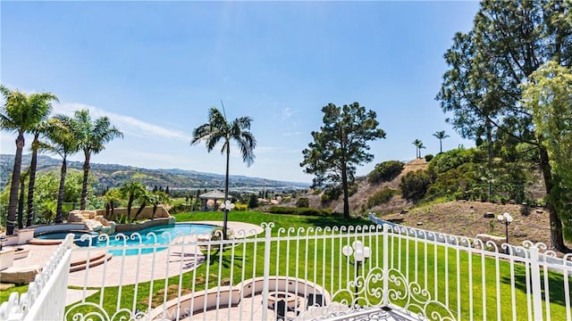view of swimming pool with a patio and a pool with connected hot tub
