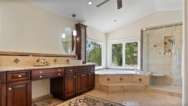 bathroom featuring lofted ceiling, a stall shower, a bath, ceiling fan, and vanity
