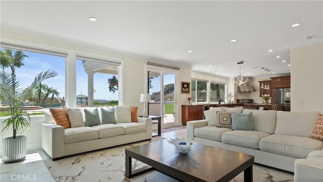 living room featuring recessed lighting and crown molding