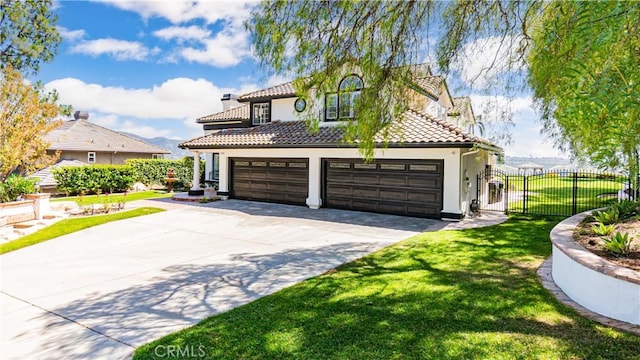 mediterranean / spanish home with concrete driveway, stucco siding, a tiled roof, an attached garage, and a chimney