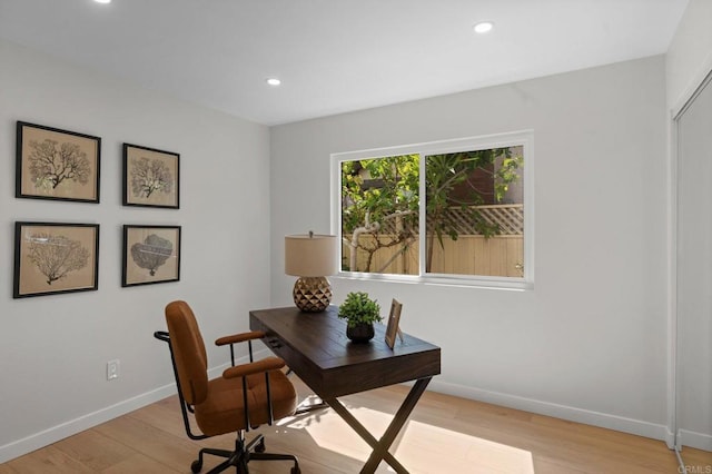 home office featuring baseboards, recessed lighting, and light wood-type flooring