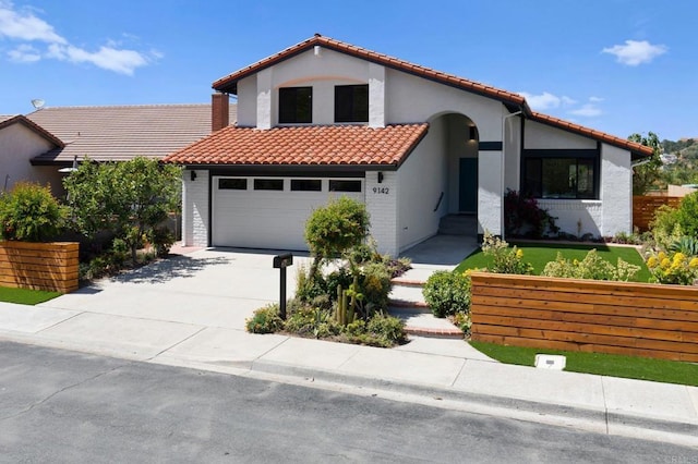 9142 Ellingham St, San Diego, CA 92129 - mediterranean / spanish house with a tile roof, concrete driveway, stucco siding, and an attached garage