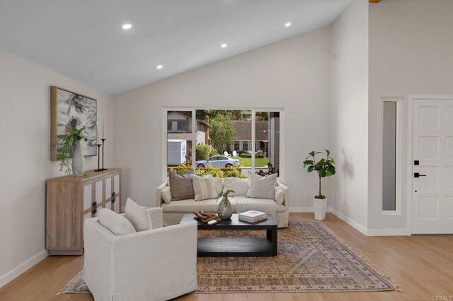 9142 Ellingham St, San Diego, CA 92129 - living room featuring wood finished floors, baseboards, recessed lighting, and high vaulted ceiling