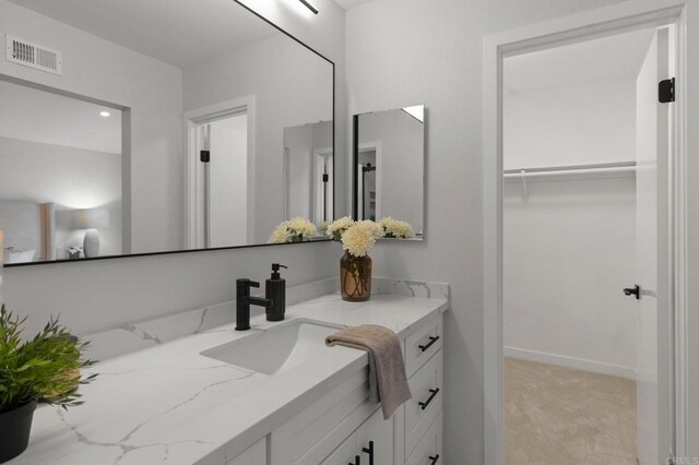 9142 Ellingham St, San Diego, CA 92129 - bathroom featuring vanity and a walk in closet