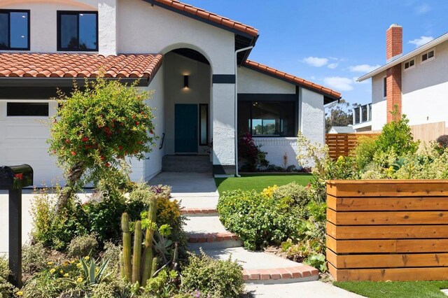 9142 Ellingham St, San Diego, CA 92129 - doorway to property featuring a tiled roof and stucco siding