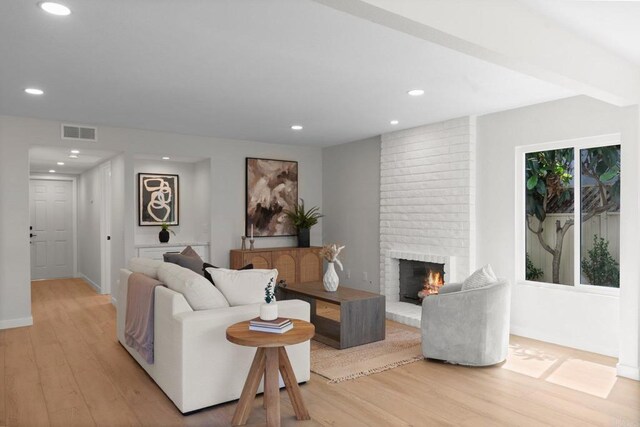 9142 Ellingham St, San Diego, CA 92129 - living room featuring light wood-type flooring, a fireplace, recessed lighting, and baseboards