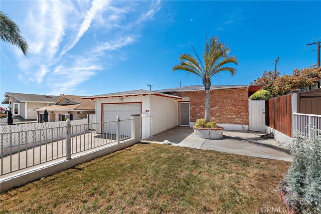 104 W Avenida Cadiz, San Clemente, CA 92672 - view of yard featuring a garage, a gate, a patio area, and concrete driveway