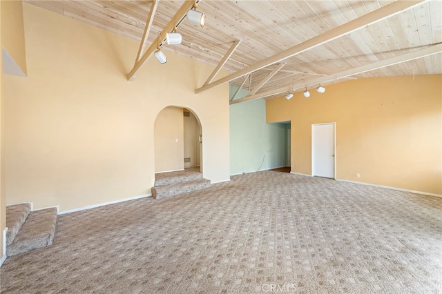 104 W Avenida Cadiz, San Clemente, CA 92672 - unfurnished room with carpet floors, arched walkways, wooden ceiling, beam ceiling, and rail lighting