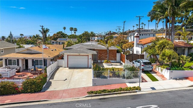 104 W Avenida Cadiz, San Clemente, CA 92672 - view of front of property with concrete driveway, a residential view, and a garage