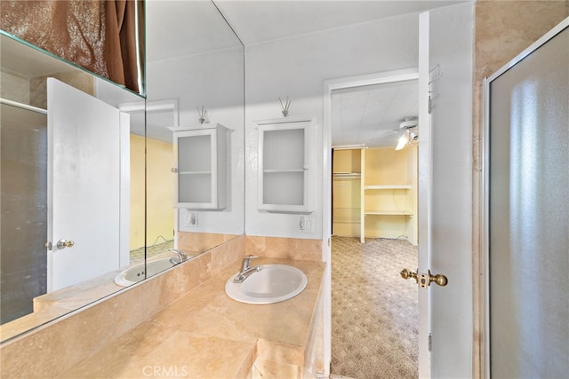 104 W Avenida Cadiz, San Clemente, CA 92672 - bathroom featuring a stall shower, ceiling fan, a spacious closet, and vanity