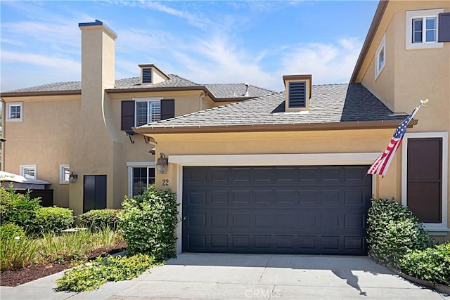 22 Amesbury Ct, Ladera Ranch, CA 92694 - view of front facade featuring stucco siding, a garage, driveway, a chimney, and a shingled roof
