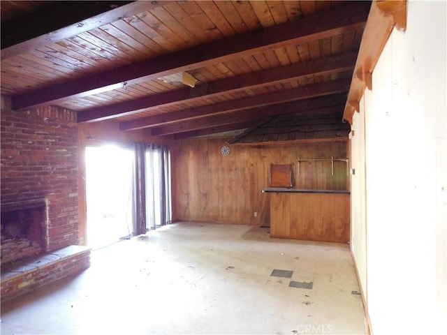 8553 Chimineas Ave, Northridge, CA 91325 - unfurnished living room with wooden walls, beamed ceiling, wooden ceiling, and a fireplace
