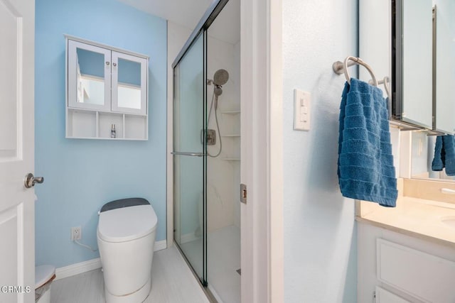 286 W Montecito Ave Unit K, Sierra Madre, CA 91024 - bathroom with toilet, a stall shower, vanity, and baseboards