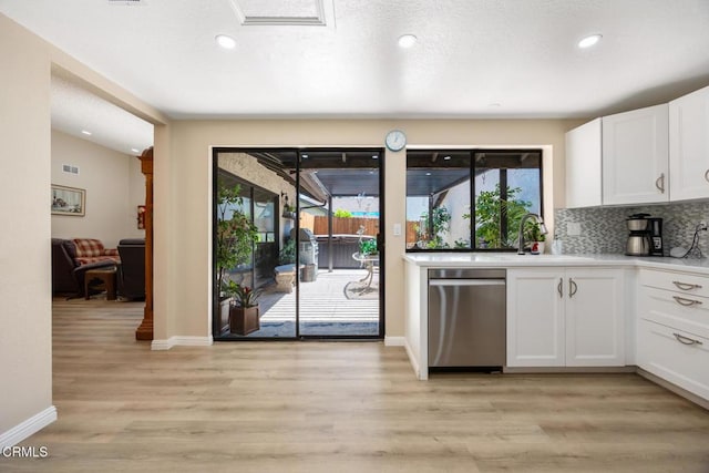 286 W Montecito Ave Unit K, Sierra Madre, CA 91024 - kitchen with dishwasher, a sink, white cabinetry, backsplash, and baseboards