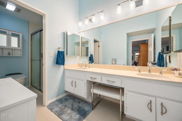286 W Montecito Ave Unit K, Sierra Madre, CA 91024 - bathroom with a shower with shower door, double vanity, and baseboards