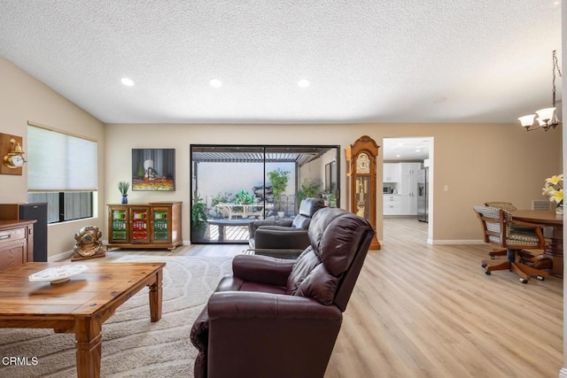 286 W Montecito Ave Unit K, Sierra Madre, CA 91024 - living room with a textured ceiling, light wood finished floors, recessed lighting, a chandelier, and baseboards