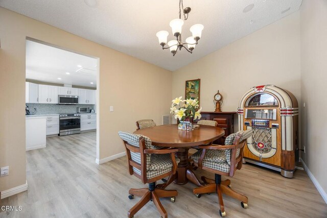 286 W Montecito Ave Unit K, Sierra Madre, CA 91024 - dining room featuring a chandelier, light wood-type flooring, baseboards, recessed lighting, and lofted ceiling