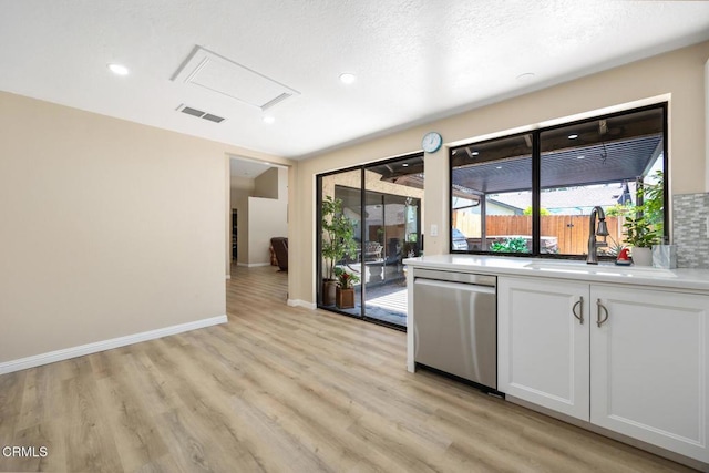 286 W Montecito Ave Unit K, Sierra Madre, CA 91024 - kitchen featuring dishwasher, a sink, light wood-type flooring, white cabinets, and recessed lighting