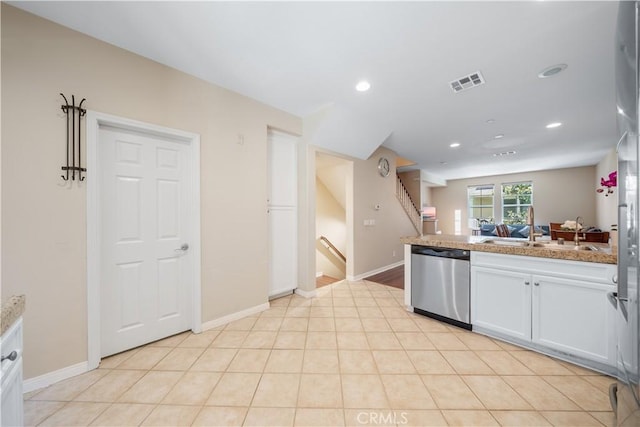 414 Silk Tree, Irvine, CA 92606 - kitchen with stainless steel dishwasher, white cabinetry, a sink, recessed lighting, and baseboards