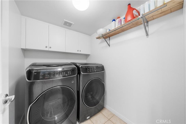 414 Silk Tree, Irvine, CA 92606 - washroom with cabinet space, washing machine and clothes dryer, light tile patterned flooring, and baseboards
