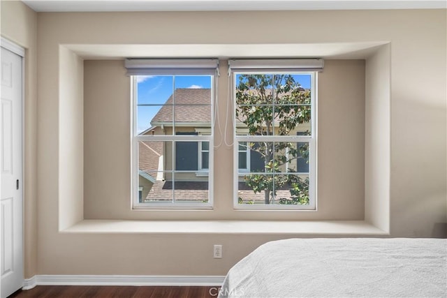 414 Silk Tree, Irvine, CA 92606 - bedroom featuring dark wood-style floors, multiple windows, baseboards, and a closet