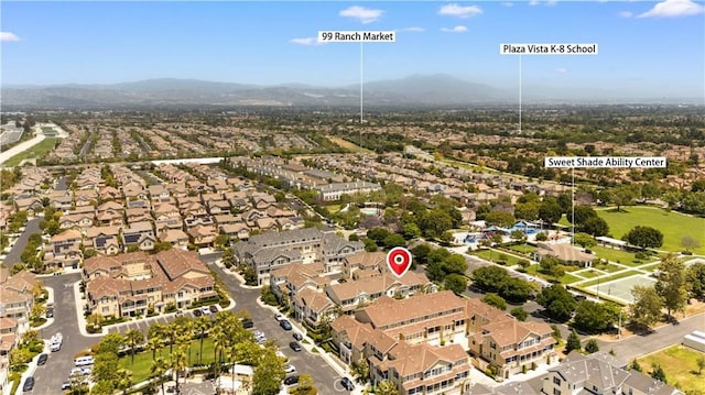 414 Silk Tree, Irvine, CA 92606 - aerial overview of property's location with a mountain backdrop and nearby suburban area
