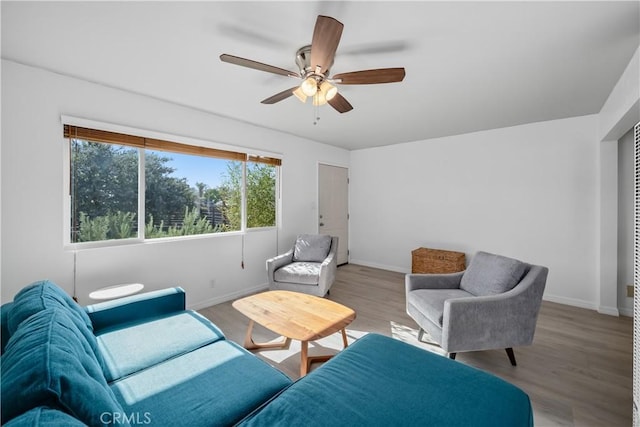1599 21st St, Oceano, CA 93445 - living room with baseboards, light wood-style floors, and ceiling fan