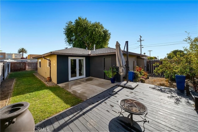 1599 21st St, Oceano, CA 93445 - back of property with a deck, a fire pit, stucco siding, and french doors