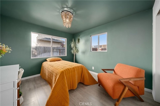 1599 21st St, Oceano, CA 93445 - bedroom with baseboards and wood finished floors