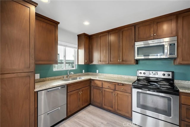 1599 21st St, Oceano, CA 93445 - kitchen featuring appliances with stainless steel finishes, a sink, recessed lighting, and brown cabinetry