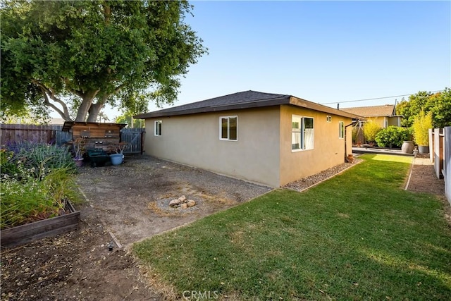1599 21st St, Oceano, CA 93445 - view of property exterior featuring stucco siding and a vegetable garden