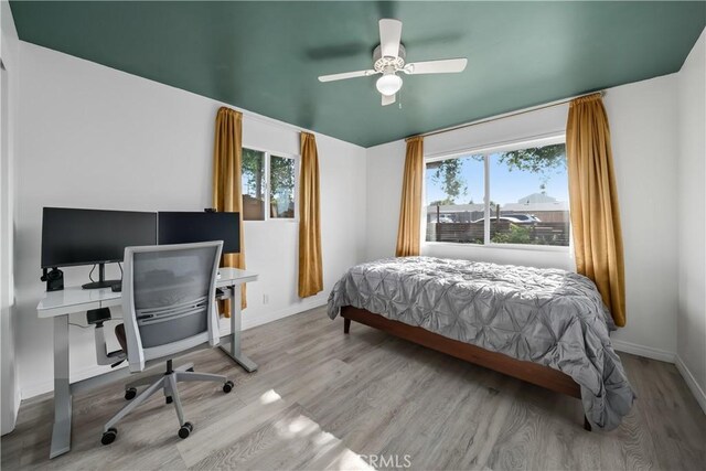 1599 21st St, Oceano, CA 93445 - bedroom with wood finished floors, an office area, baseboards, and ceiling fan
