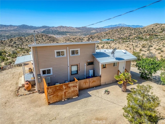56714 Nelson Ave, Yucca Valley, CA 92284 - rear view of property with a mountain view and view of desert landscape