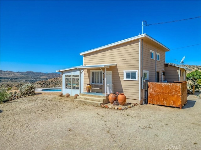 56714 Nelson Ave, Yucca Valley, CA 92284 - rear view of property featuring a mountain view