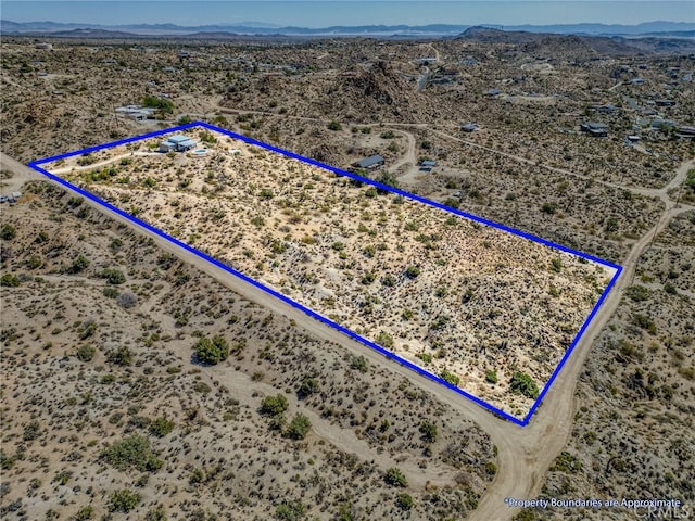56714 Nelson Ave, Yucca Valley, CA 92284 - overview of rural landscape with a desert landscape, property parcel outlined, and mountains