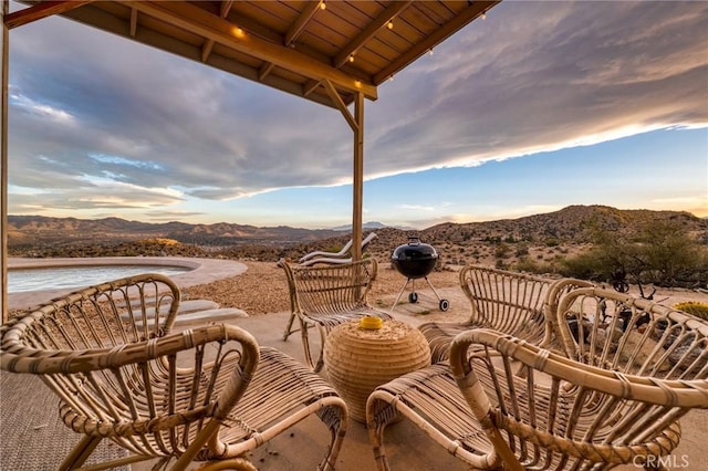 56714 Nelson Ave, Yucca Valley, CA 92284 - patio terrace at dusk with a patio area and a water and mountain view
