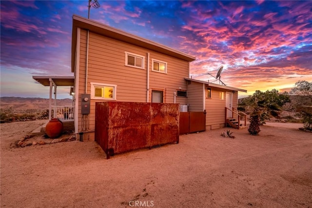56714 Nelson Ave, Yucca Valley, CA 92284 - back of property at dusk featuring entry steps