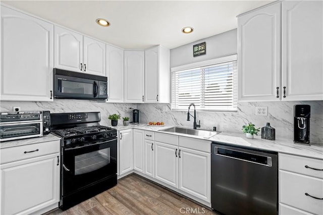 20155 Keaton St, Canyon Country, CA 91351 - kitchen featuring black appliances, a sink, white cabinetry, wood finished floors, and recessed lighting
