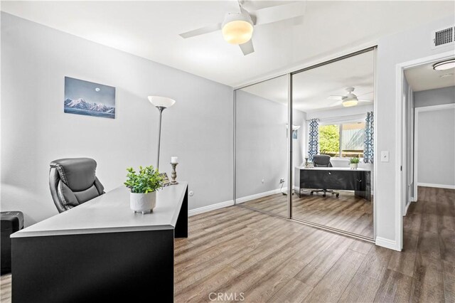 20155 Keaton St, Canyon Country, CA 91351 - home office featuring a ceiling fan, wood finished floors, and baseboards