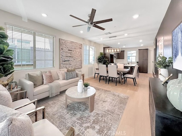 843 Cranberry Way, Upland, CA 91786 - living room featuring light wood-type flooring, a ceiling fan, recessed lighting, and baseboards