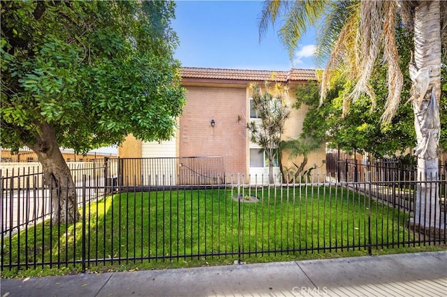 9051 Cedros Ave Unit 5, Panorama City, CA 91402 - view of front of house with brick siding, stucco siding, and a tiled roof