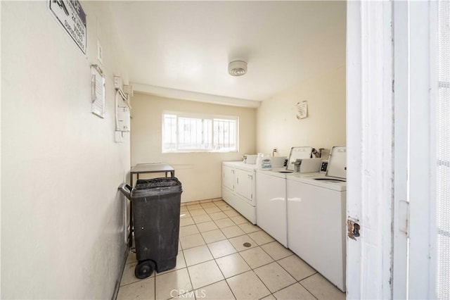 9051 Cedros Ave Unit 5, Panorama City, CA 91402 - community laundry room featuring independent washer and dryer and light tile patterned floors